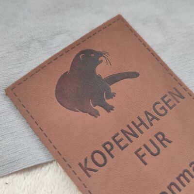 Customizable Embossed Leather Patches using eco friendly top grain leather with blind embossing and color filled embossing techniques for finish